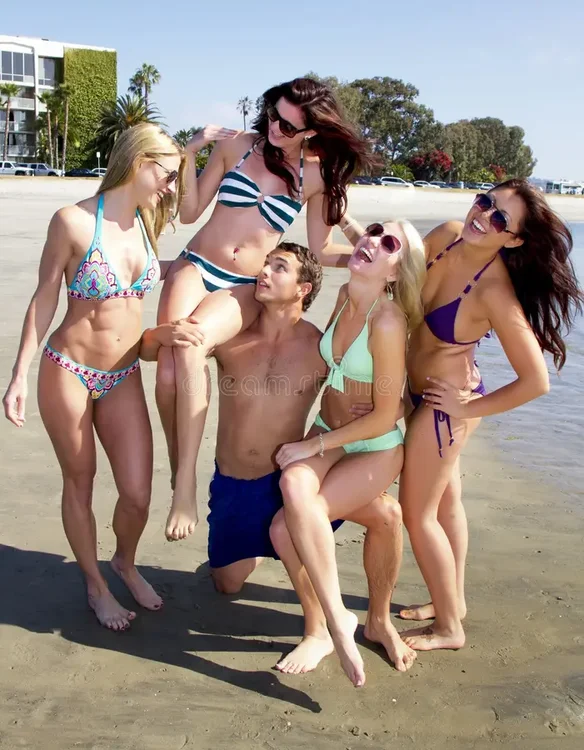 four-beautiful-young-women-enjoying-beach-26037905.webp